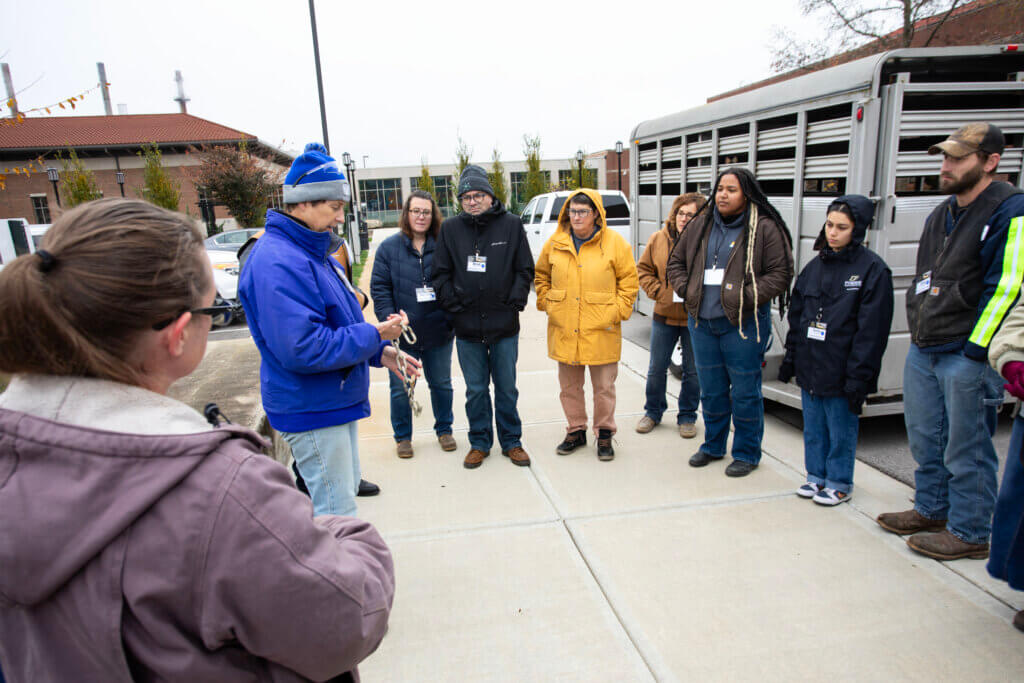 Trailer safety expert Robin Ridgway, who serves as Purdue director of environmental health and safety compliance, discusses safety chains during her trailer safety demonstration outside Lynn Hall.