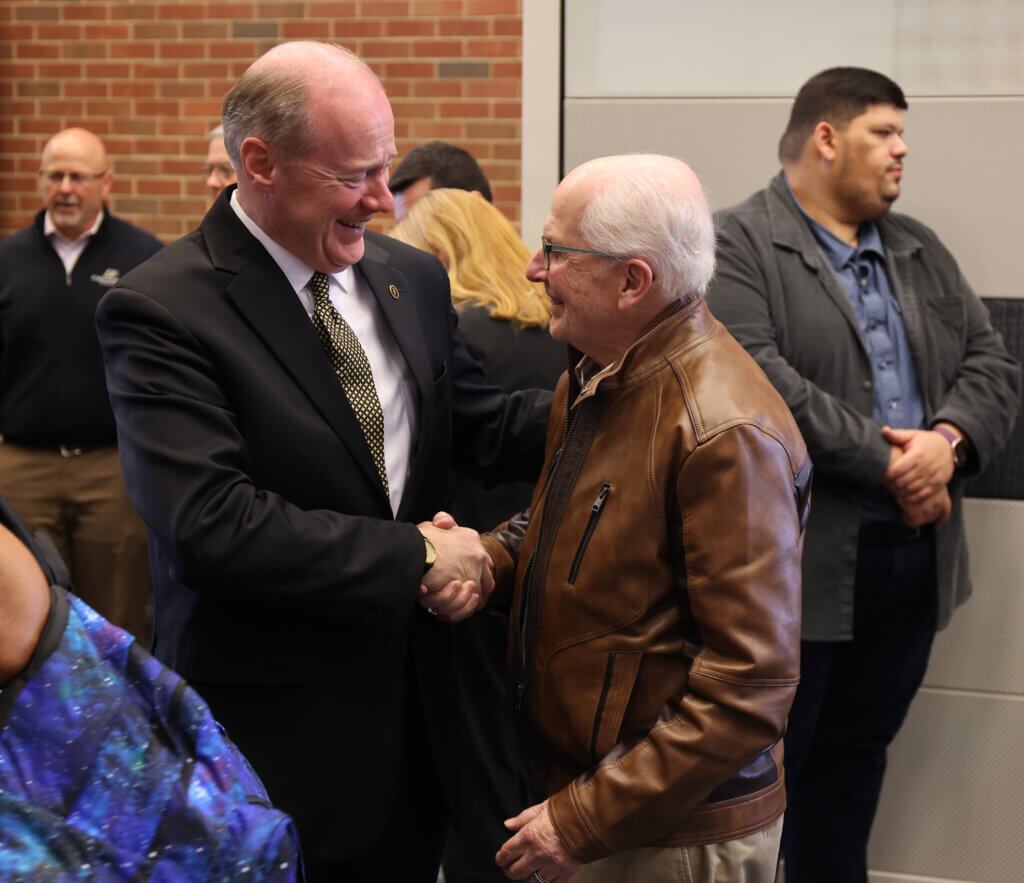 New PVM Dean Bret Marsh is greeted by one of his former teachers, Dr. Ronald Hullinger, Professor Emeritus of Basic Medical Sciences.