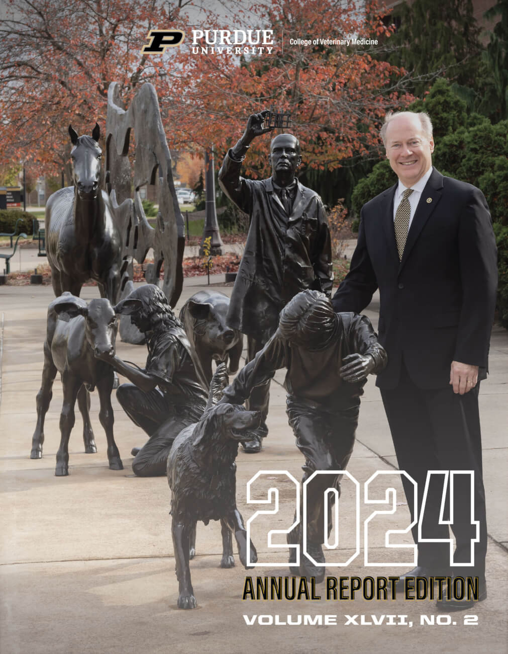 The cover image for the 2024 Annual PVM Report, featuring dean Bret Marsh standing next to the Continuum sculpture outside Lynn Hall