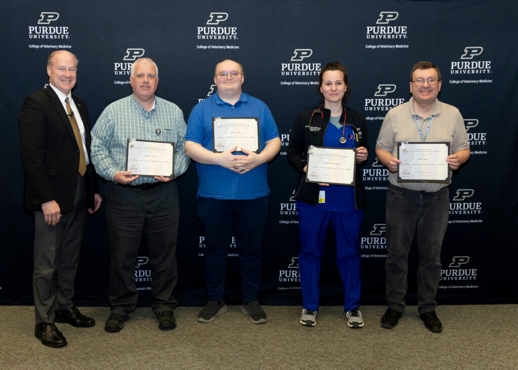 Staff members Brett Creech, Kyle Moffit and John Meyer and a resident, Dr. Vanessa Passenegg (2nd from right) were recognized for recently completing the Online Certificate Program for Diversity and Inclusion in Veterinary Medicine.