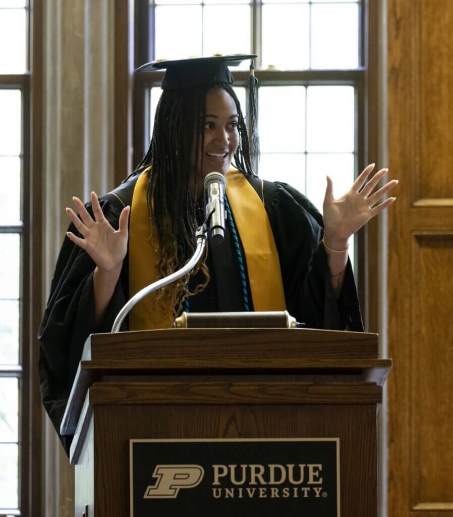 Aaliyah Turner, BS, RVT, standing at the graduation podium, speaking expressed gratitude toward the DVM Class of 2025, classmates, faculty, and family.