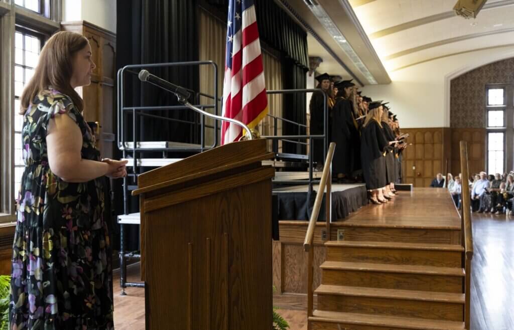 Jennifer Smith, RVT, senior instructional technologist for the Veterinary Nursing program leading the graduates in reciting the Veterinary Technician Oath.
