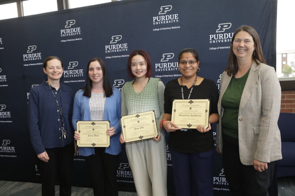 Drs. Wendy Beauvais (left) and Susan Mendrysa (right) recognize PVM Graduate Student Research Award recipients Jeanna Blake and Yueyi Chen (tied for 2nd) and Annapoorani Jegatheesan (first place).
