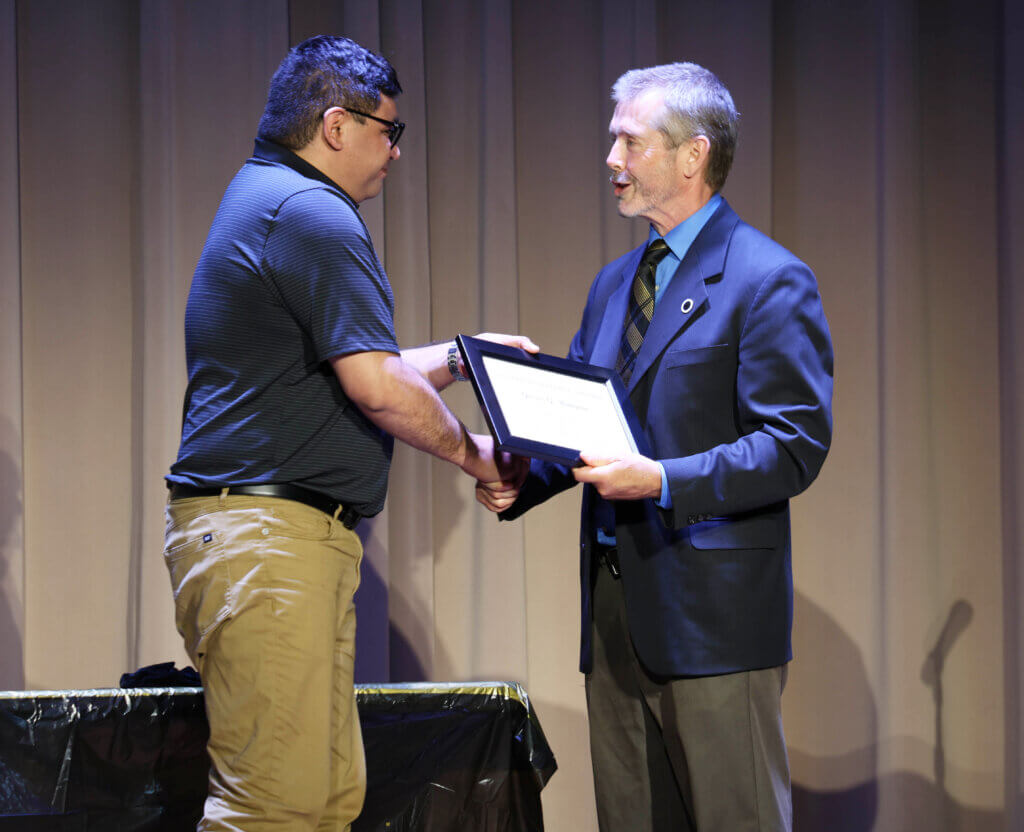 Dr. Tim Lescun, interim head of the VCS Department, presented the Graduate Teaching Award to Dr. George Munguia.