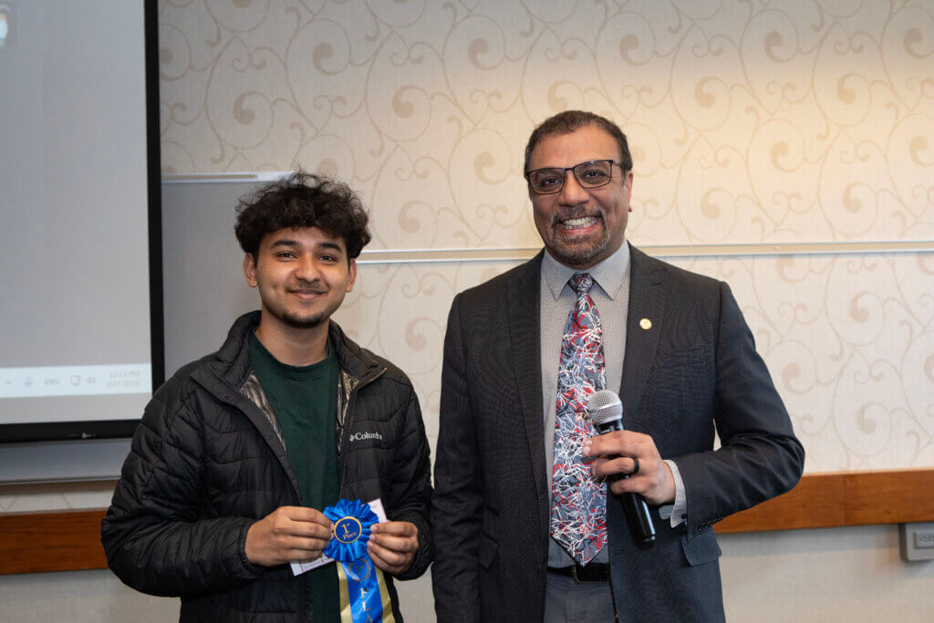 First-place prize-winner in the Undergraduate Division of the Poster Contest, Purdue biochemistry student Shreyes Kanumuru with Dr. Narayanan.