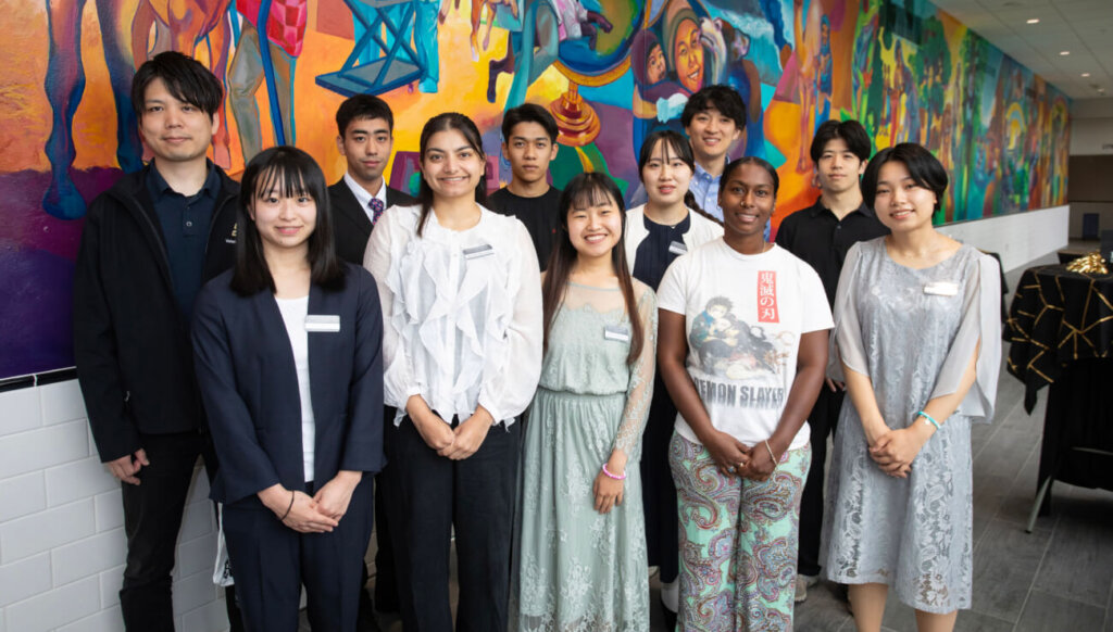 Members of the visiting delegation from Japan’s Kitasato and Rakuno universities gathered for a photo before a reception in their honor in the hallway connecting Lynn Hall with the Brunner Purdue Veterinary Medical Hospital Complex.