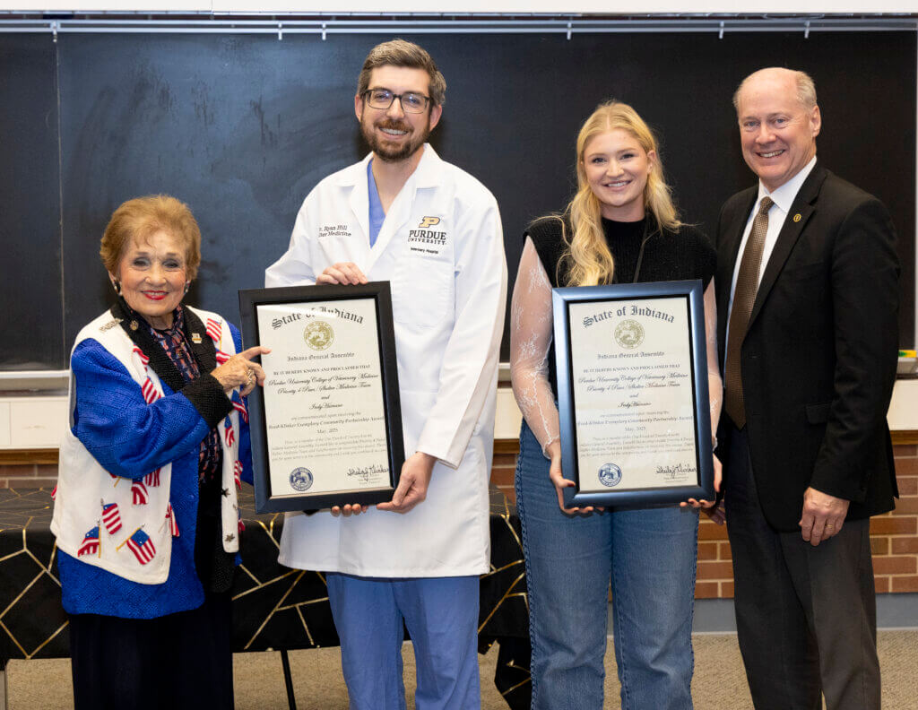 State Representative Sheila Klinker (left) joined Dean Bret Marsh to present the inaugural Reed-Klinker Exemplary Community Partnership Award to Dr. Ryan Hill, PVM Priority 4 Paws clinician, and Jenna Kaufman of IndyHumane.