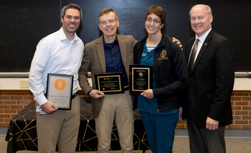 PVM Dean Bret Marsh (right) with faculty award recipients (left-right) Dr. Rafael Neves, Dr. Harm HogenEsch and Dr. Stephanie Thomovsky.