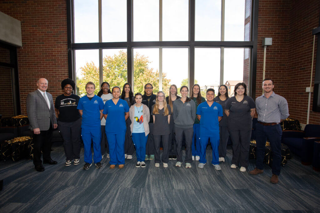 Dean Bret Marsh and Global Engagement Director Addison Sheldon with Global Veterinary Certificate recipients (left-right): Tamea Smith, Payton Love, Amanda Mills, Joyce Jia, Twinkle Kaur, Alicia Ramirez, Azure Patterson, Jessica Agonis, Emily Godollei-Jacob, Rebekah Addison, Maya Fulton, Jose Meza Sanchez, Megan Muñoz and Riley Beliveau.