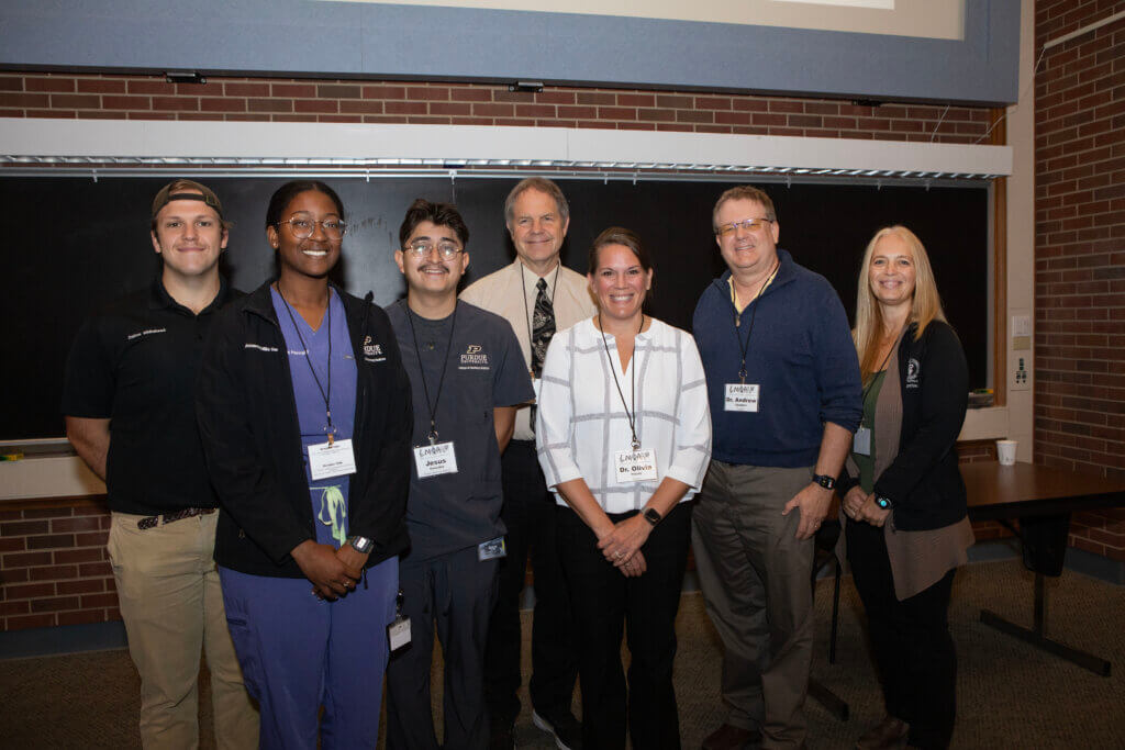 (Left-right) Purdue veterinary students and symposium volunteers Dalton Whitehead, Amanda Mills and Jesus Gonzales with conference speakers Dr. Steve Thompson, Dr. Olivia Petritz, Dr. Andrew Stamper and Dr. Lori Corriveau.