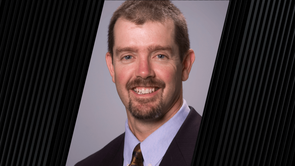 portrait of a man wearing a suit jacket and tie