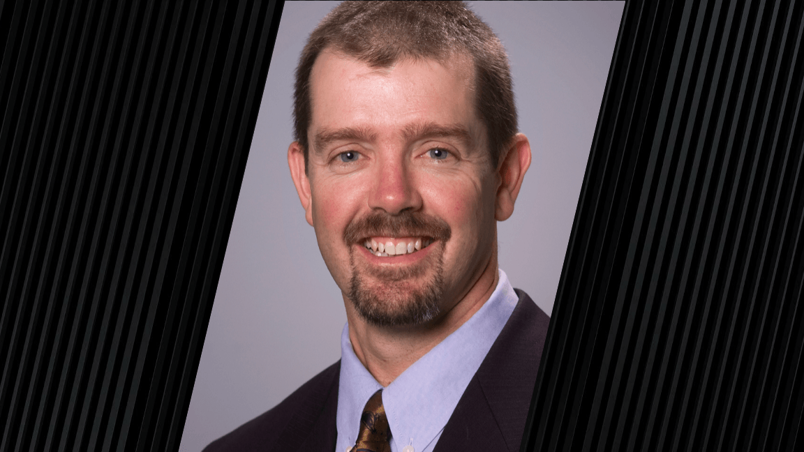 portrait of a man wearing a suit jacket and tie