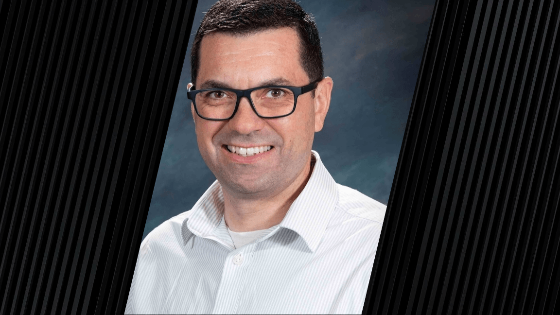 man wearing glasses and a white button-up shirt