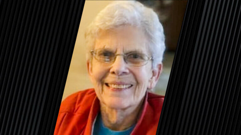 woman wearing glasses and a red jacket