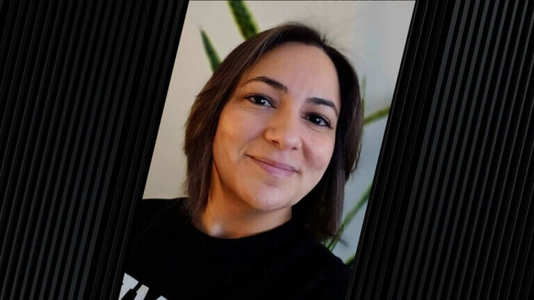 woman with short hair and wearing a black shirt