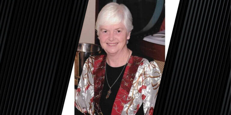 portrait of woman wearing a white and red jacket