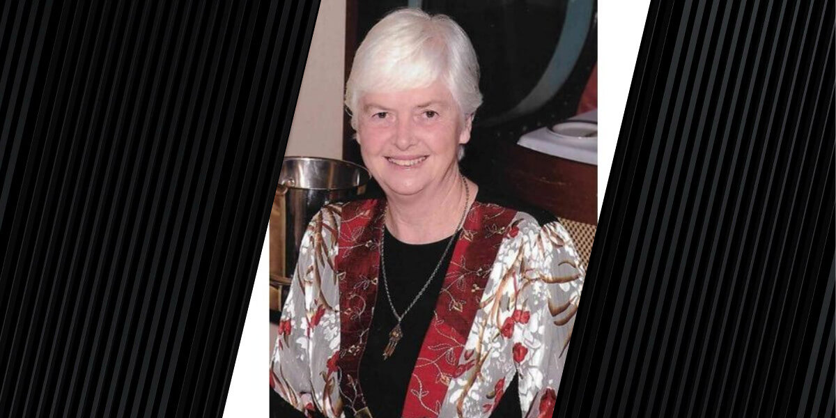 portrait of woman wearing a white and red jacket