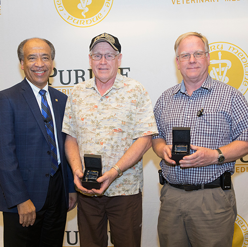 Dean Willie Reed with (center) Robert White (ADDL) and Dave Chasey (VAD), who both were recognized for 35 years of service to Purdue (not pictured: Donna Schrader, ADDL).