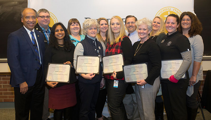 A total of eleven PVM staff members were honored for completing the Certificate Program for Diversity and Inclusion in Veterinary Medicine: (left-right) Jeremy Wampler (VTH), Malathi Raghavan (VAD), Cindy Misenheimer (VTH), Danielle Buchanan (VAD), Andrea Brown (VAD), Dr. Lori Corriveau (VTH), Wil Gwin (VTH), Grace Craig (VAD), Tricia Johnson (VAD), Tami Lind (VTH), and Susan Xioufaridou (VAD).