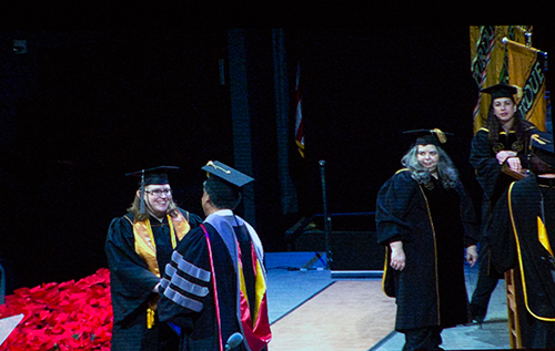 Purdue Veterinary Technology BS-VT degree recipient Jennifer Hartman is congratulated by Purdue Veterinary Medicine Dean Willie Reed on stage at the Elliott Hall of Music during Purdue University's 2017 Winter Commencement Ceremony Sunday, December 17.