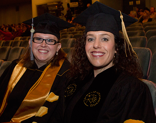 New Purdue BS-VT graduate Jennifer Hartman and Veterinary Technology Program Director Bianca Zenor await the start of the Winter Commencement Ceremony in the Elliott Hall of Music.