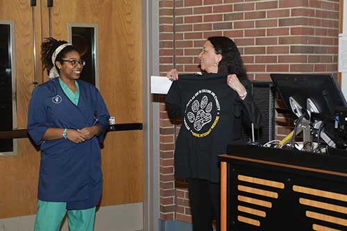 VOICE chapter president Morgan Fortune presents a VOICE T-shirt to Dr. Christine Jenkins as a gesture of appreciation for her lecture as the Martin Luther King Jr. Keynote Speaker during PVM’s Inclusive Excellence Week.