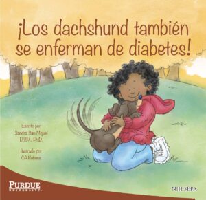 A kid cuddles a happy dachshund while sitting together in a grassy park.